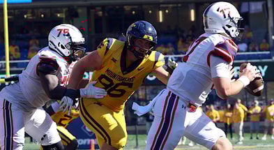West Virginia defensive lineman Edward Vesterinen closes in on the quarterback