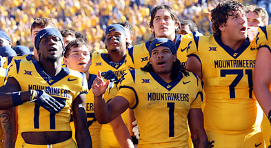 West Virginia's players celebrate the win over Robert Morris by singing Country Roads