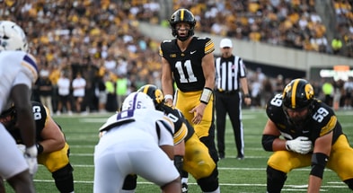 Mark Gronowski awaits a snap in the game against Albany. (Photo by Dennis Scheidt)