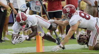 Alabama WR Rico Scott and TE Josh Cuevas
