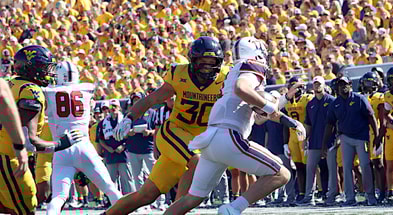 West Virginia linebacker Chase Wilson closes in on the quarterback
