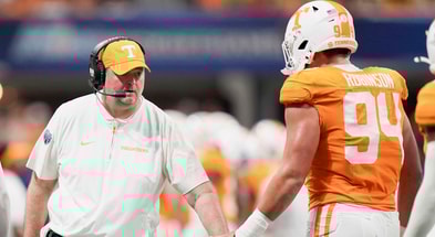 Brianna Paciorka/News Sentinel / USA TODAY NETWORK via Imagn Images | Tennessee head coach Josh Heupel high fives Tennessee defensive lineman Nathan Robinson (94) during the Aflac Kickoff Game between the Volunteers and Syracuse held at Mercedes-Benz Stadium in Atlanta, Ga., on August 30, 2025.