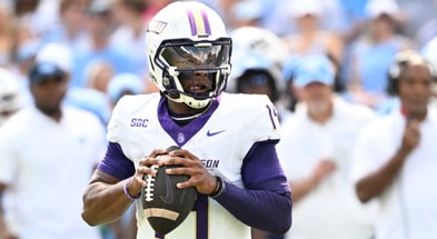 Sep 21, 2024; Chapel Hill, North Carolina, USA; James Madison Dukes quarterback Alonza Barnett III (14) looks to pass in the second quarter at Kenan Memorial Stadium. Mandatory Credit: Bob Donnan-Imagn Images