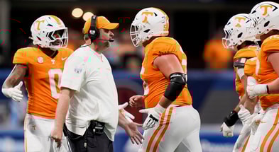 Brianna Paciorka/News Sentinel / USA TODAY NETWORK via Imagn Images | Tennessee head coach Josh Heupel high fives players running off the field during the Aflac Kickoff Game between the Volunteers and Syracuse held at Mercedes-Benz Stadium in Atlanta, Ga., on August 30, 2025.
