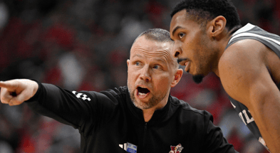 Jan 28, 2025; Louisville, Kentucky, USA; Louisville Cardinals head coach Pat Kelsey talks with center Frank Anselem-Ibe (13) during the second half against the Wake Forest Demon Deacons at KFC Yum! Center. Louisville defeated Wake Forest 72-59. Mandatory Credit: Jamie Rhodes-Imagn Images