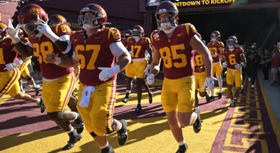 USC Trojans players run on to the field for the game against the Georgia Southern Eagles at United Airlines Field at the Los Angeles Memorial Coliseum