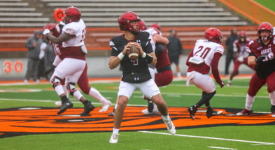 Logan Fife drops back to pass in practice