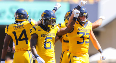 West Virginia's defense forces the fourth down against Robert Morris