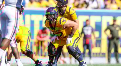 West Virginia offensive lineman Phillip Bowser before the snap