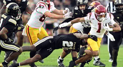 USC Trojans running back Eli Sanders (1) is tackled by Purdue Boilermakers defensive back Tahj Ra-El (21) during the second quarter at Ross-Ade Stadium
