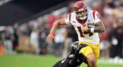 USC Trojans quarterback Jayden Maiava (14) is tackled by Purdue Boilermakers defensive back Hudauri Hines (4) during the second quarter at Ross-Ade Stadium