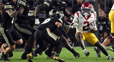 USC Trojans running back Waymond Jordan (2) runs the ball toward Purdue Boilermakers defensive back Tony Grimes (0) during the second half at Ross-Ade Stadium