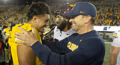 Cal quarterback Jaron-Keawe Sagpolutele and head coach Justin Wilcox