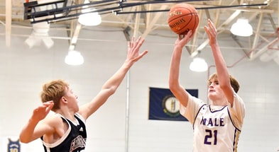 Male’s Trey Hillerich (21) shoots over the defense of Frederick Douglass' Tate Robinson (13) during the first half of their game in the King Of The Bluegrass Tournament, Thursday, Dec. 19 2024 in Louisville Ky.  © Timothy D. Easley/Special to the Courier-Journal / USA TODAY NETWORK via Imagn Images