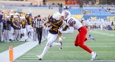 West Virginia wide receiver Rodney Gallagher scores against Kansas in 2024