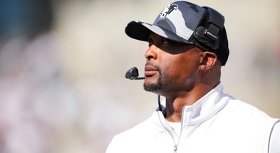 Sep 6, 2025; Cincinnati, Ohio, USA; Bowling Green Falcons head coach Eddie George works to the sideline against the Cincinnati Bearcats in the first half at Nippert Stadium. Mandatory Credit: Aaron Doster-Imagn Images