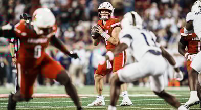 Louisville Cardinals quarterback Miller Moss (7) drops back while looking to pass in the first half. The Cards' beat the visiting Dukes 28-14 Friday September 5, 2025 at L&N Credit Union Stadium in Louisville, Kentucky.