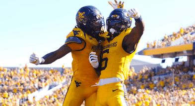 West Virginia's players celebrate the touchdown