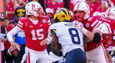 Sep 20, 2025; Lincoln, Nebraska, USA; Nebraska Cornhuskers quarterback Dylan Raiola (15) passes against Michigan Wolverines edge Derrick Moore (8) during the third quarter at Memorial Stadium. Mandatory Credit: Dylan Widger-Imagn Images