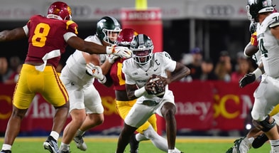 Michigan State Spartans quarterback Aidan Chiles (2) runs the ball against the Southern California Trojans during the first half at the Los Angeles Memorial Coliseum. - Gary A. Vasquez, USA TODAY Sports