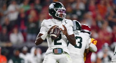 Michigan State Spartans quarterback Aidan Chiles (2) drops back to pass against the Southern California Trojans during the second half at the Los Angeles Memorial Coliseum. - Gary A. Vasquez, USA TODAY Sports