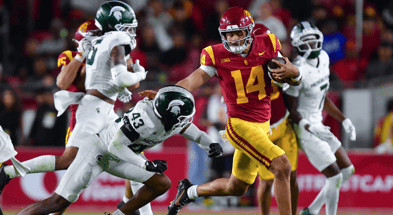 USC Trojans quarterback Jayden Maiava (14) runs the ball against Michigan State Spartans defensive back Malik Spencer (43) during the second half at the Los Angeles Memorial Coliseum