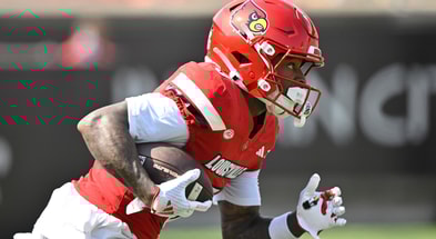 Sep 20, 2025; Louisville, Kentucky, USA; Louisville Cardinals wide receiver Caullin Lacy (5) returns a kickoff against the Bowling Green Falcons during the first quarter at L&N Federal Credit Union Stadium. Mandatory Credit: Jamie Rhodes-Imagn Images