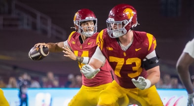 UC quarterback Jayden Maiava passes behind protection from Tobias Raymond