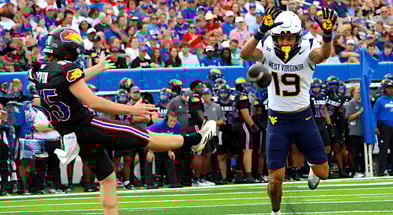 West Virginia's Nick Taylor attempt to block the punt