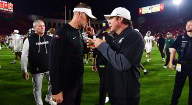 Southern California Trojans head coach Lincoln Riley meets with Michigan State Spartans head coach Jonathan Smith following the game at the Los Angeles Memorial Coliseum. - Gary A. Vasquez, USA TODAY Sports