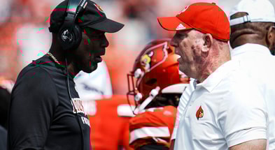 Louisville football head coach Jeff Brohm, right, talks with defense coordinator Ron English as the Cards take on Bowling Green in football Saturday, Sept. 20, 2025, in Louisville, Kentucky