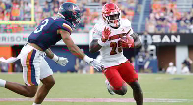 Oct 12, 2024; Charlottesville, Virginia, USA; Louisville Cardinals running back Isaac Brown (25) carries the ball past Virginia Cavaliers safety Corey Thomas Jr. (3) to score a touchdown during the second half at Scott Stadium. Mandatory Credit: Amber Searls-Imagn Images