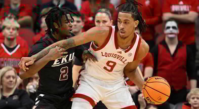 Nov 27, 2024; Paradise Island, Bahamas, BHS; Louisville Cardinals forward Khani Rooths (9) reacts with Louisville Cardinals guard Terrence Edwards Jr. (5) after scoring during the second half against the Indiana Hoosiers at the Atlantis Resort. Mandatory Credit: Kevin Jairaj-Imagn Images