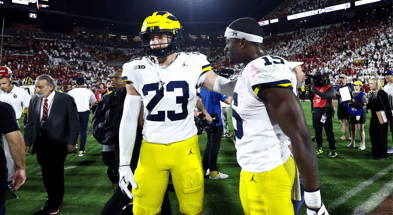 Sep 6, 2025; Norman, Oklahoma, USA; Michigan Wolverines linebacker Ernest Hausmann (15) and linebacker Cole Sullivan (23) resct after the game against the Oklahoma Sooners at Gaylord Family-Oklahoma Memorial Stadium. Mandatory Credit: Kevin Jairaj-Imagn Images