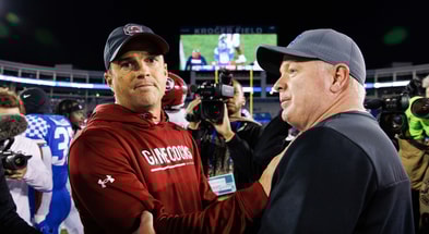 Oct 8, 2022; Lexington, Kentucky, USA; South Carolina Gamecocks head coach Shane Beamer and Kentucky Wildcats head coach Mark Stoops shake hands after a game at Kroger Field. Mandatory Credit: Jordan Prather-Imagn Images