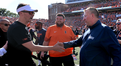 Illinois Fighting Illini head coach Bret Bielema, and USC Trojans head coach Lincoln Riley shake hands after the 34-32 Illini win at Memorial Stadium