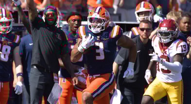 Illinois Fighting Illini running back Kaden Feagin (3) runs for a touchdown as USC Trojans linebacker Anthony Beavers Jr. (15) pursues during the second half at Memorial Stadium