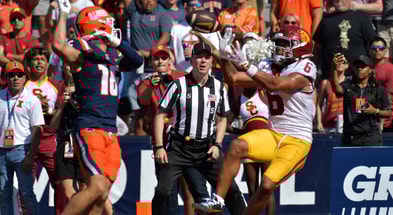 USC Trojans wide receiver Makai Lemon (6) scores a touchdown on a pass from quarterback Jayden Maiava (14) as Illinois Fighting Illini defensive back Tanner Heckel (16) defends during the second half at Memorial Stadium