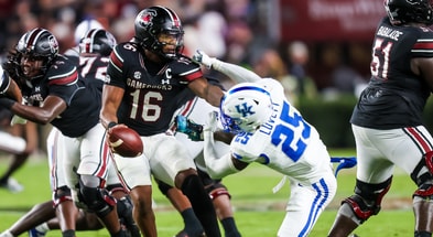 South Carolina QB LaNorris Sellers stiff-arms Kentucky DB Jordan Lovett, via Jeff Blake-Imagn Images
