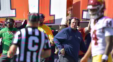 Illinois Fighting Illini head coach Bret Bielema looks on as USC Trojans quarterback Jayden Maiava (14) talks with an official during the first half at Memorial Stadium