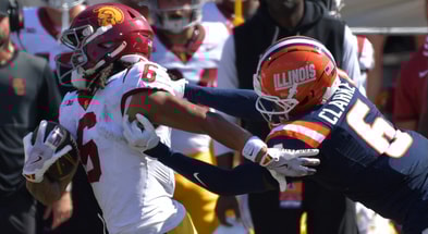Illinois Fighting Illini defensive back Jaheim Clarke (6) pursues USC Trojans wide receiver Makai Lemon (6) during the second half at Memorial Stadium