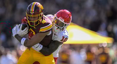 Minnesota wide receiver Jalen Smith brought down by Rutgers defensive back Jacobie Henderson