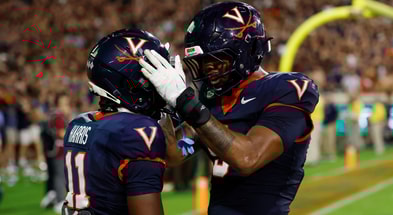 Sep 26, 2025; Charlottesville, Virginia, USA; Virginia Cavaliers wide receiver Trell Harris (11) celebrates with Cavaliers tight end Dakota Twitty (9) after catches a two point conversion as Florida State Seminoles defensive back Jerry Wilson (19) defends in the second overtime period at Scott Stadium. Mandatory Credit: Geoff Burke-Imagn Images