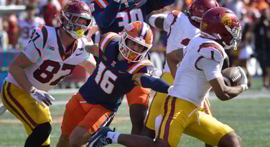 USC Trojans running back Eli Sanders (1) tries to elude the tackle of Illinois Fighting Illini defensive back Tanner Heckel (16) during the second half at Memorial Stadium