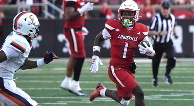 Louisville’s Isaac Brown runs the ball against Virginia at L&N Stadium Saturday. Ocr. 4, 2025