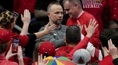 Louisville's head coach Pat Kelsey goes through the crowd after the win over Stanford Saturday at KFC Yum! Center. March 8, 2025