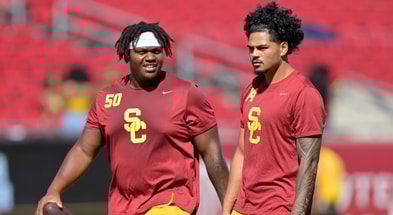 USC Trojans offensive lineman J'Onre Reed (50) quarterback Jayden Maiava (14) warm up prior to the game against the Georgia Southern Eagles at United Airlines Field at Los Angeles Memorial Coliseum