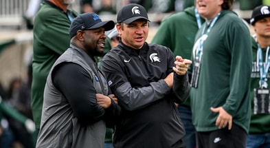 Michigan State's head coach Jonathan Smith, right, talks with UCLA's interim head coach Tim Skipper before the football game on Saturday, Oct. 11, 2025, at Spartan Stadium in East Lansing. - Nick King, USA TODAY Sports