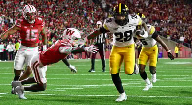 The best shots of the action between the Hawkeyes and Badgers. (Photo by Dennis Scheidt)