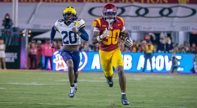 USC running back King Miller runs away from a Michigan defender